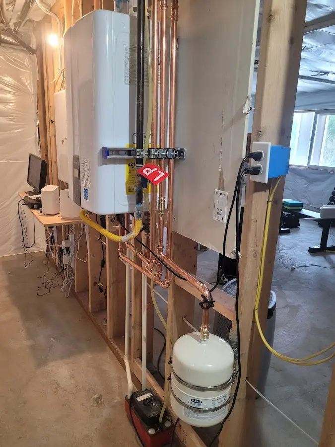 Licensed plumber repairing a kitchen sink in Boardman